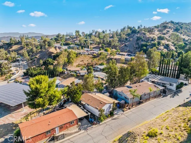 an aerial view of a houses with a yard