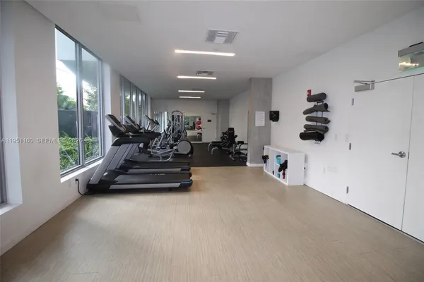a kitchen with a sink stainless steel appliances and cabinets