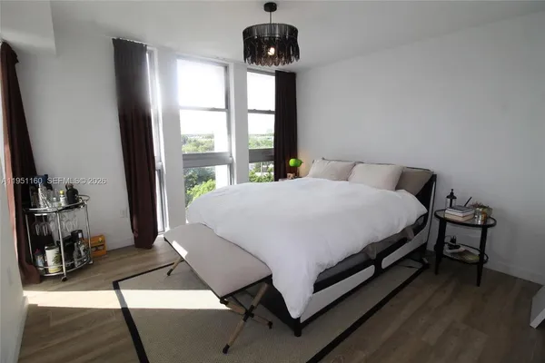 a kitchen with stainless steel appliances a refrigerator a sink a stove and cabinets