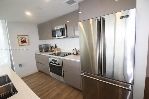 a view of a living room and a floor to ceiling window or room