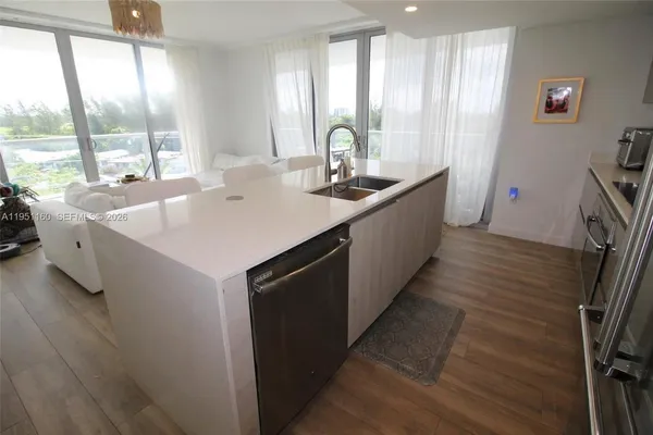a view of a balcony with wooden floor and bench