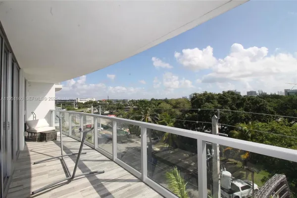 a view of balcony with furniture