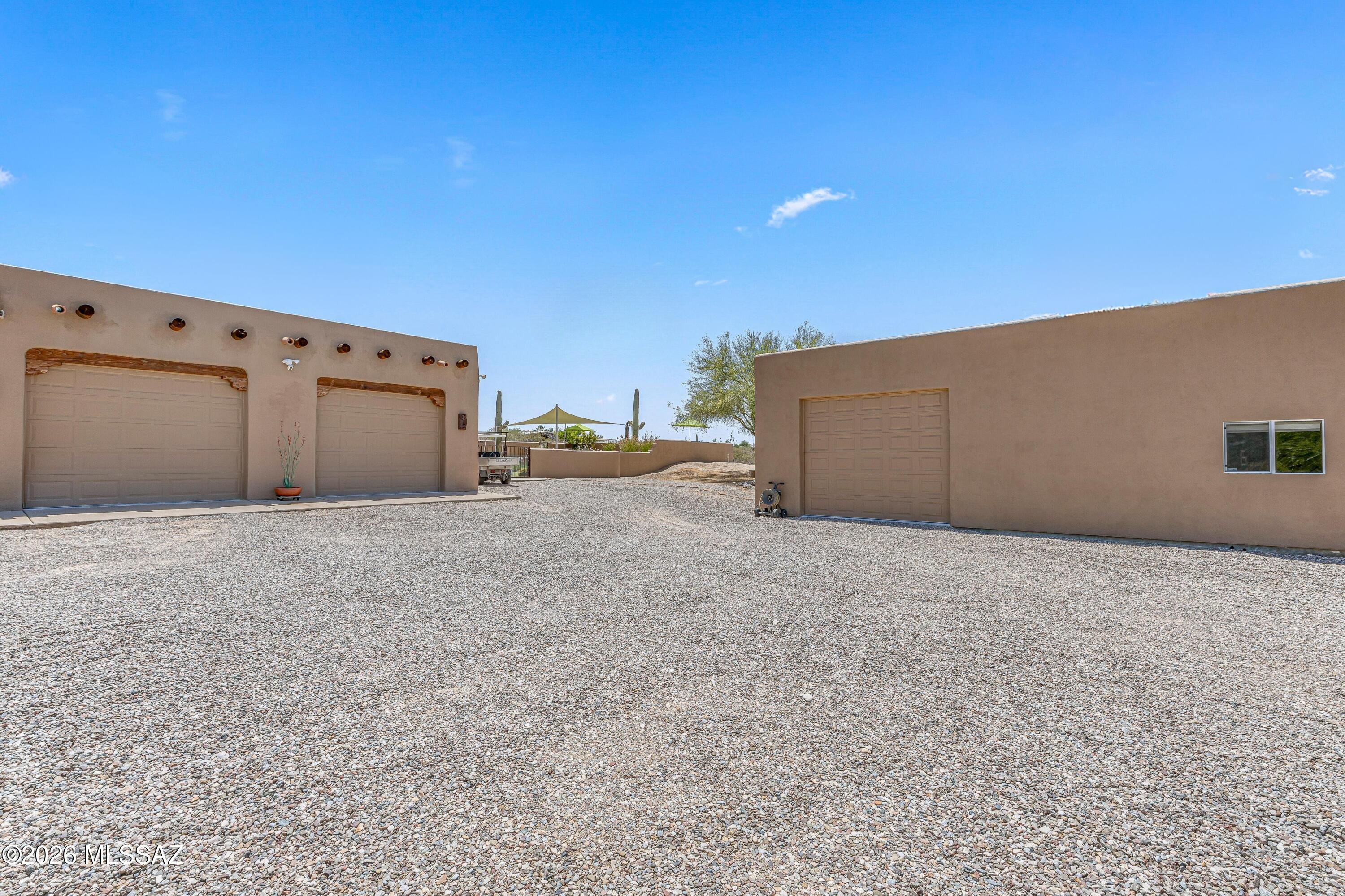 11160 East Golf Links Road Tucson, AZ 85730 - Photo 35 of 51 Two car attached garage to the left, workshop/RV parking and/or 3 car garage to the right.