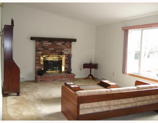 73 Primrose Hill Road Barrington, RI 02806 - Photo 2 of 7 Living Room. Sunfilled Living Room with Cathedral Ceilings, Skylight and Brick Fireplace