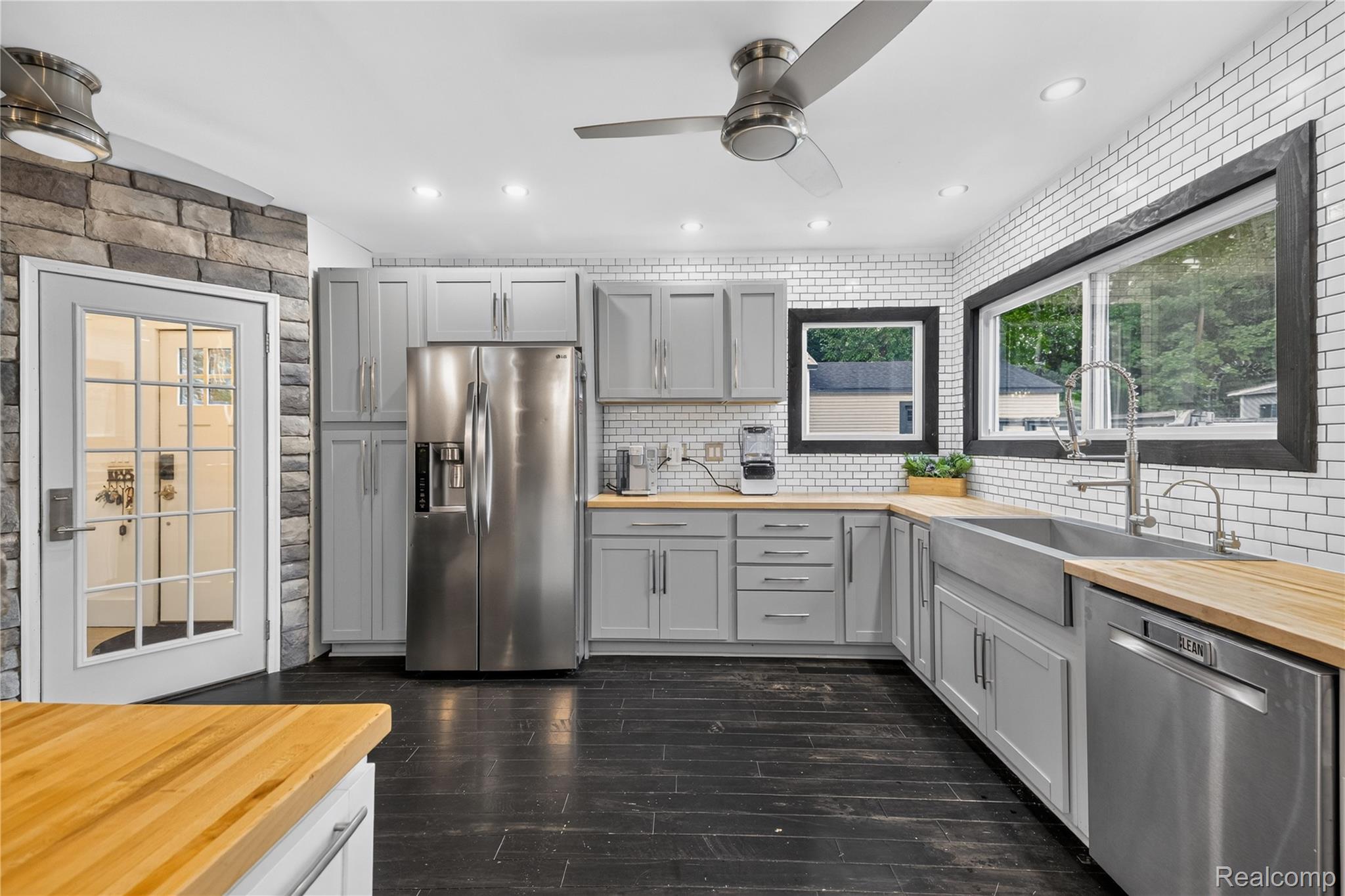 4860 Blue Bush Road Monroe, MI 48162 - Photo 12 of 59 Modern kitchen featuring wood-finish countertops, stainless steel appliances, and a white subway tile backsplash