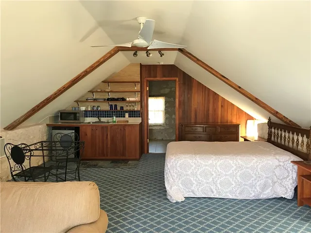 a bedroom with bed and window