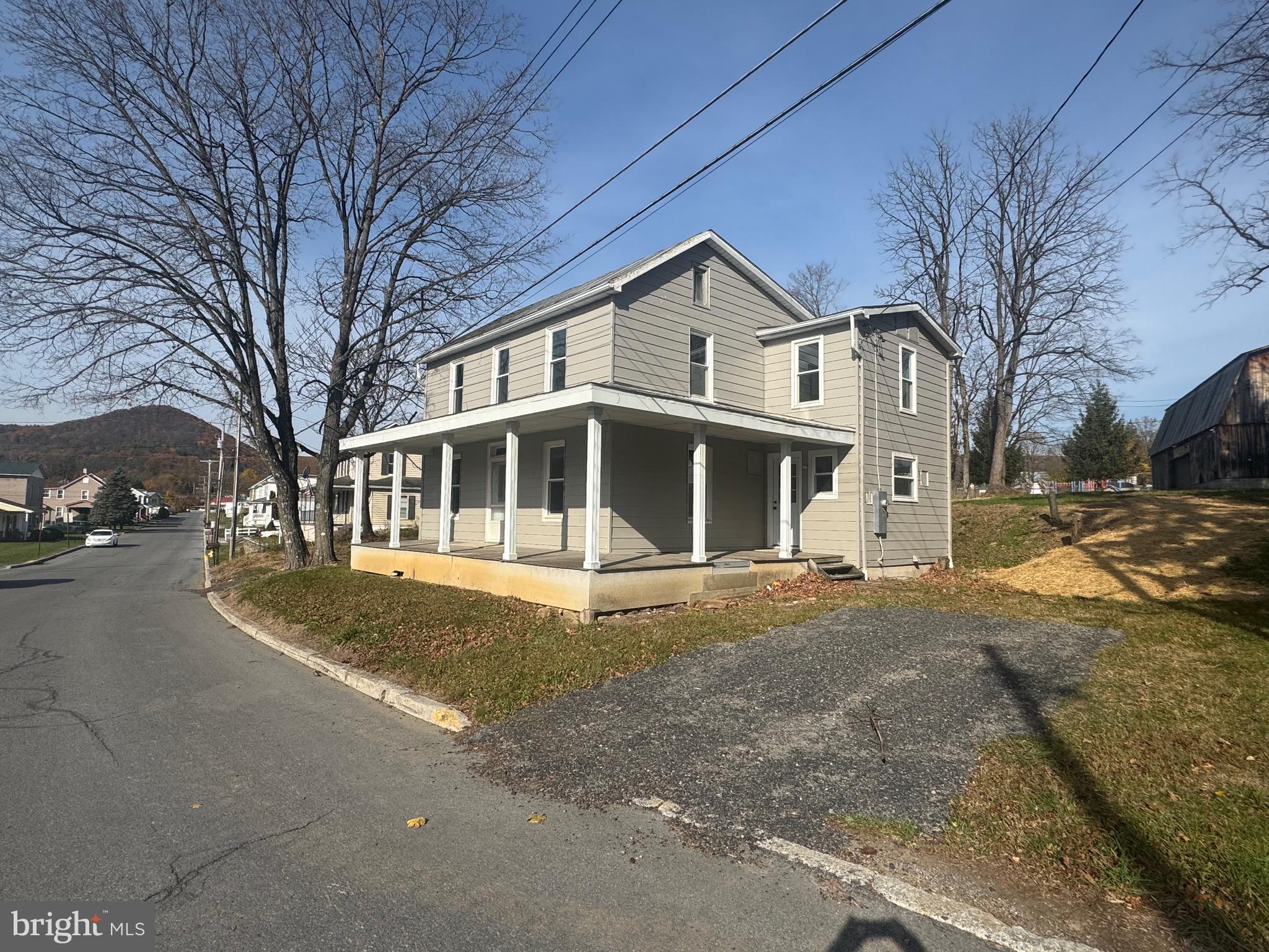 85 Maclay Street Milroy, PA 17063 - Photo 2 of 24 a front view of a house with a yard