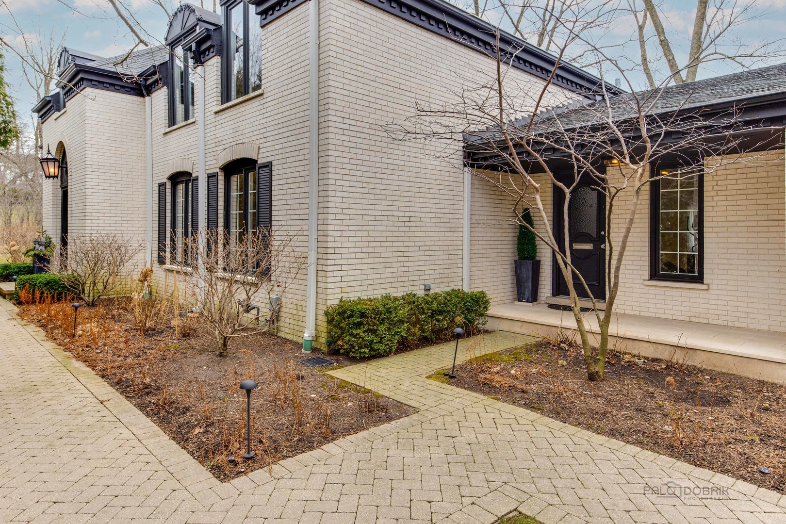 a front view of a house with garden