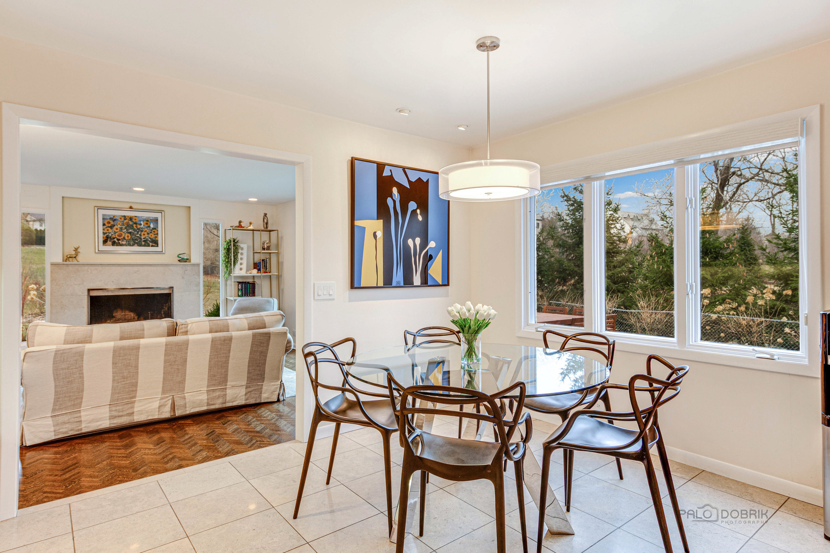 783 Valley Road Glencoe, IL 60022 - Photo 12 of 45 a dining room with furniture a chandelier and wooden floor