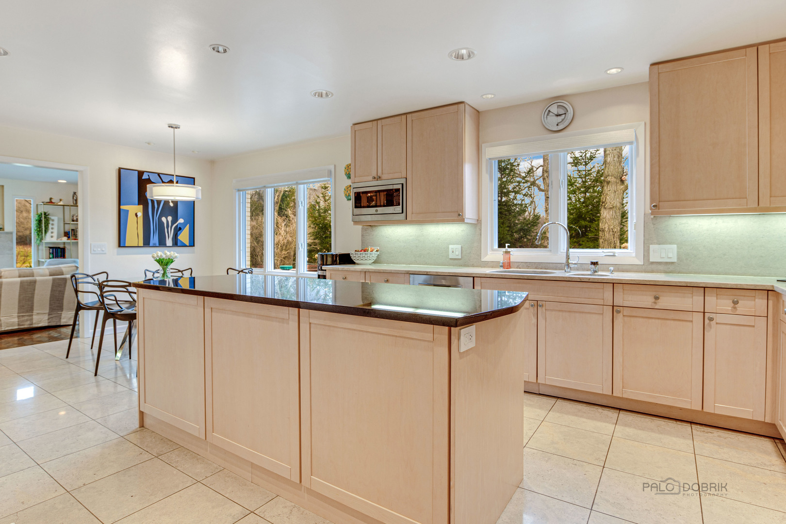 783 Valley Road Glencoe, IL 60022 - Photo 14 of 45 a kitchen with granite countertop white cabinets a counter top space and stainless steel appliances