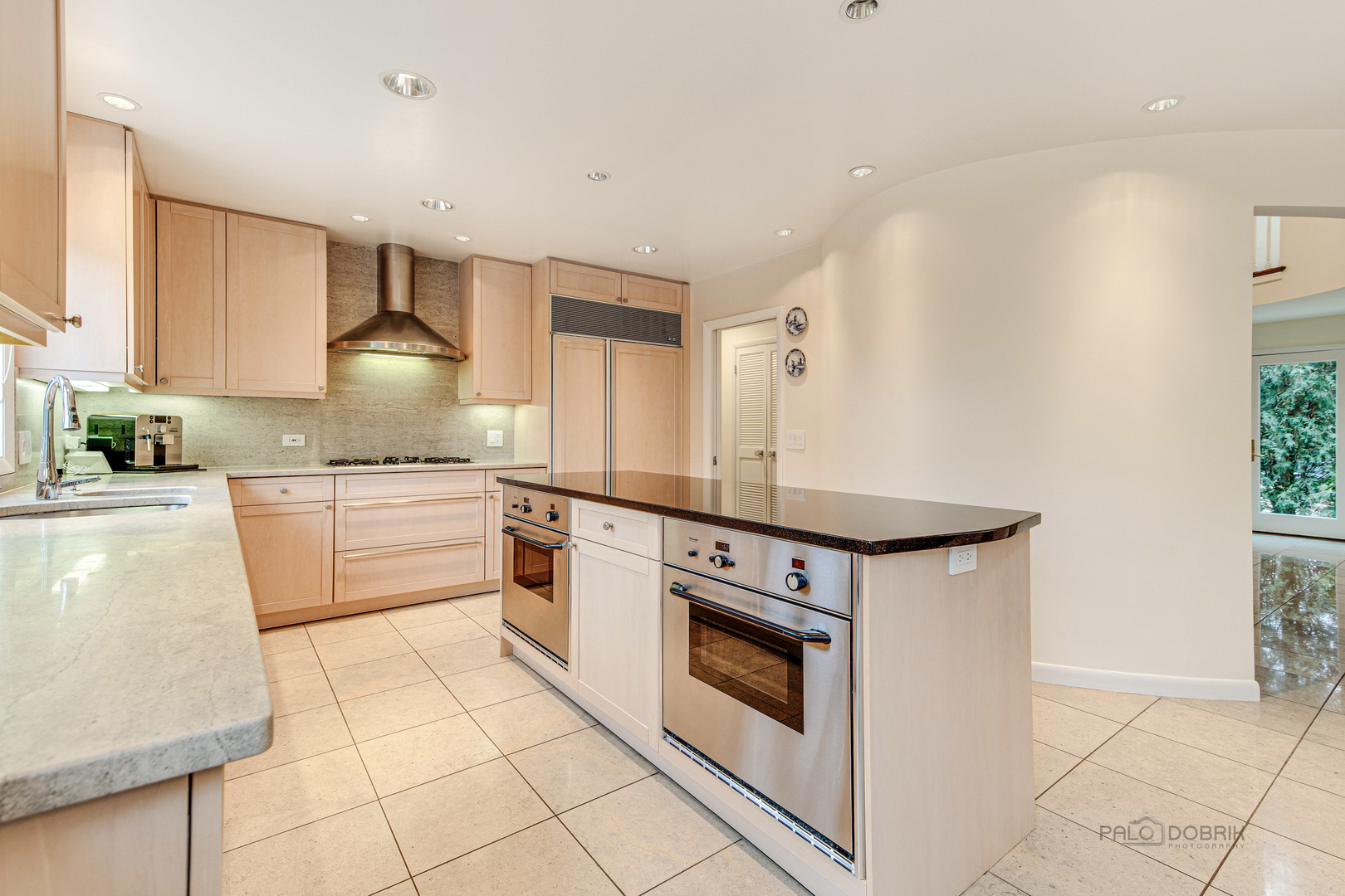 783 Valley Road Glencoe, IL 60022 - Photo 15 of 45 a kitchen with granite countertop white cabinets and white appliances