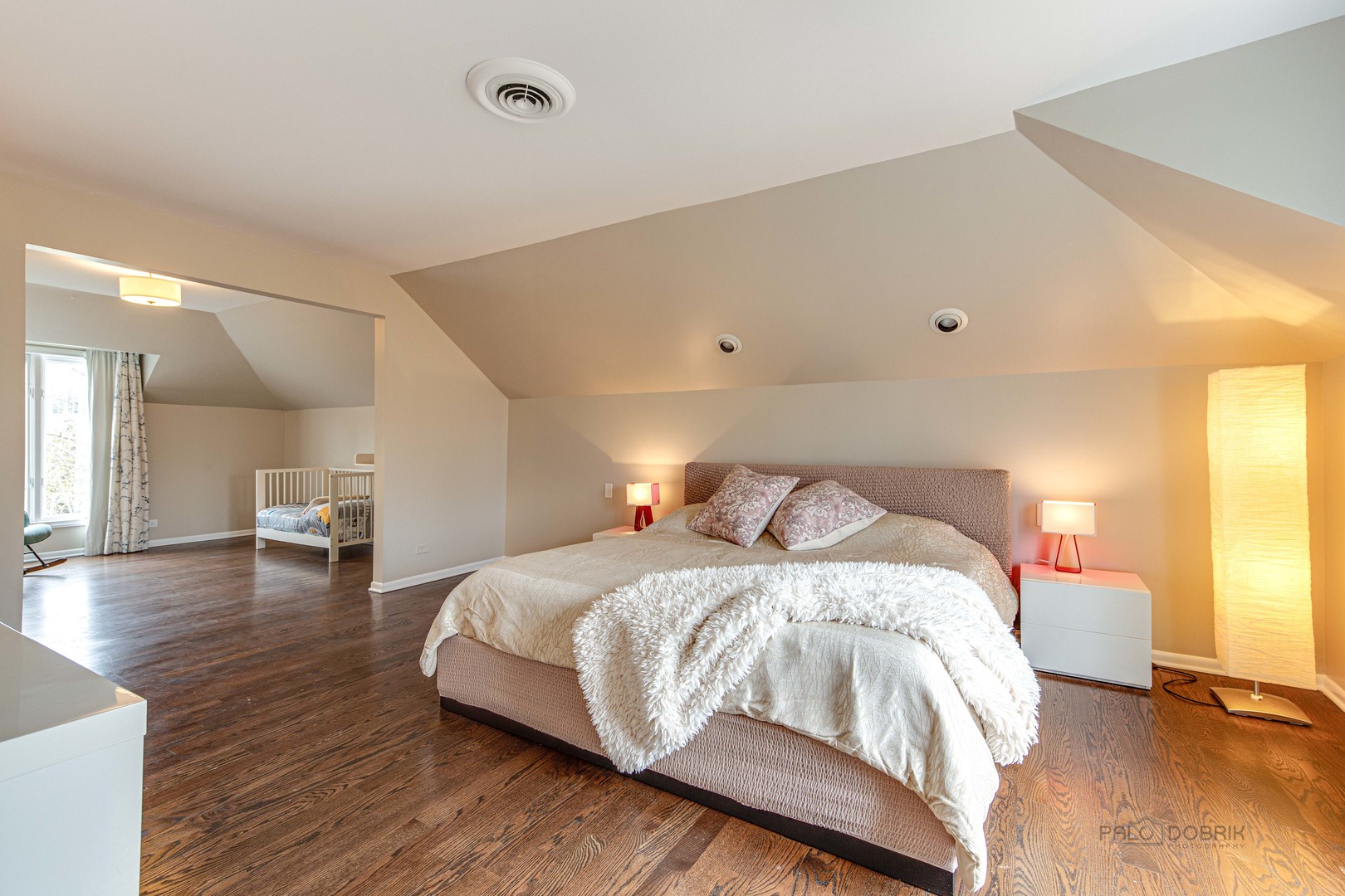 783 Valley Road Glencoe, IL 60022 - Photo 27 of 45 a bedroom with a bed and wooden floor