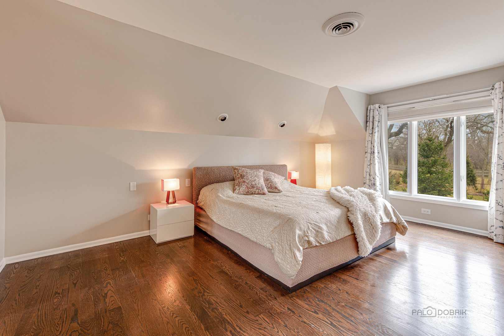 783 Valley Road Glencoe, IL 60022 - Photo 28 of 45 a large bed sitting in a spacious bedroom next to a window and a larger closet
