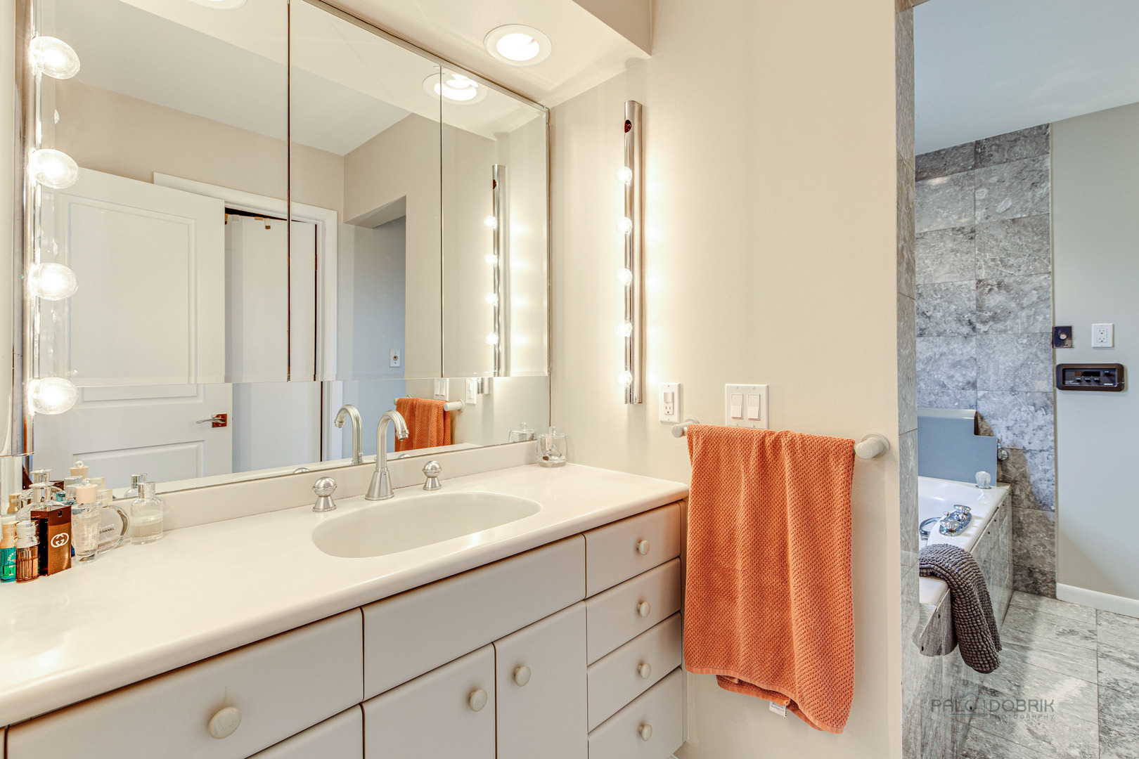 783 Valley Road Glencoe, IL 60022 - Photo 32 of 45 a bathroom with a sink and a mirror