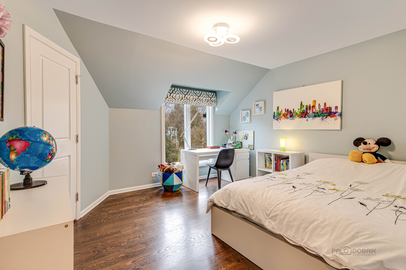 783 Valley Road Glencoe, IL 60022 - Photo 34 of 45 a bedroom with a bed and a chandelier