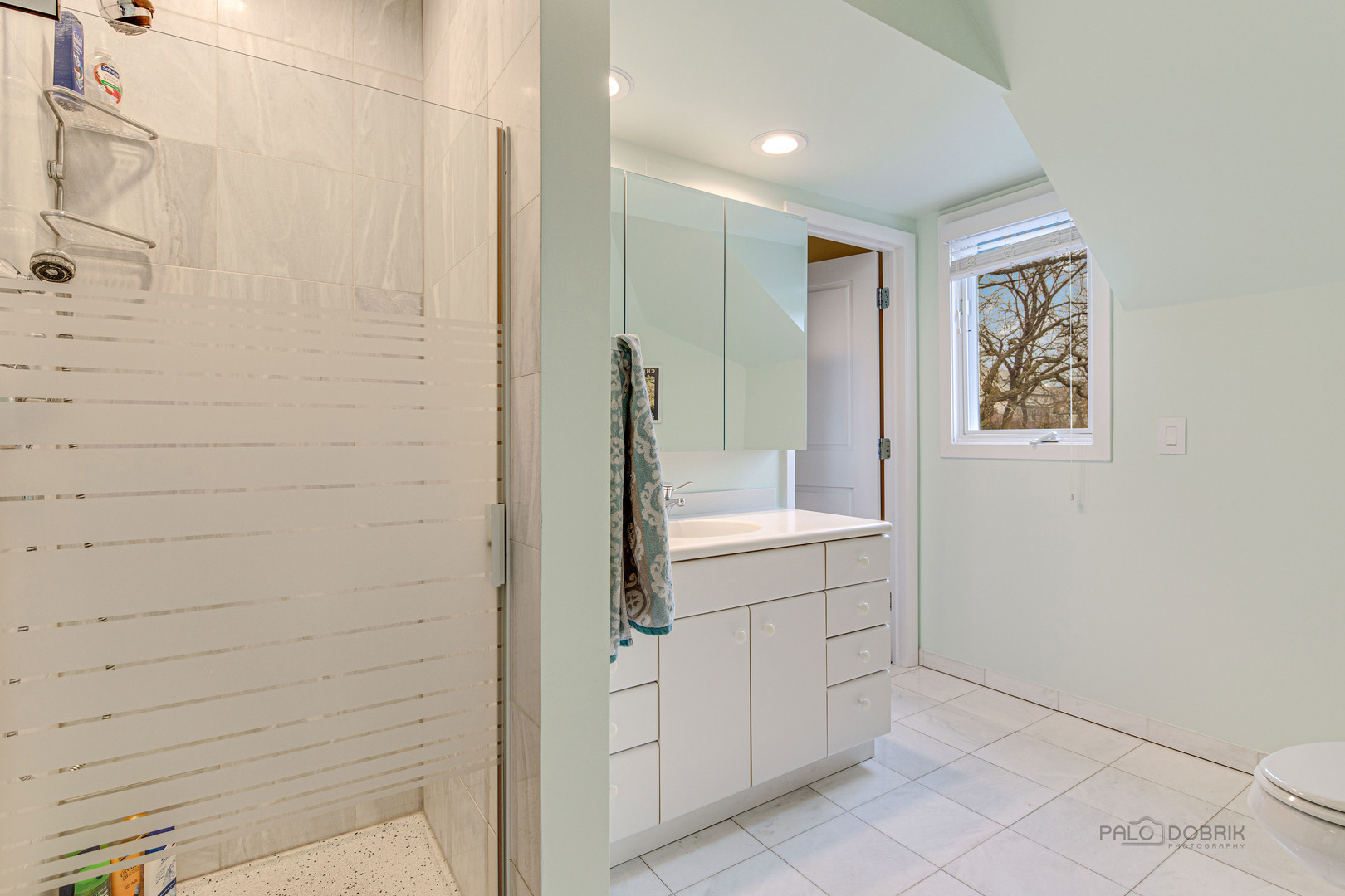 783 Valley Road Glencoe, IL 60022 - Photo 36 of 45 a bathroom with a shower and a sink