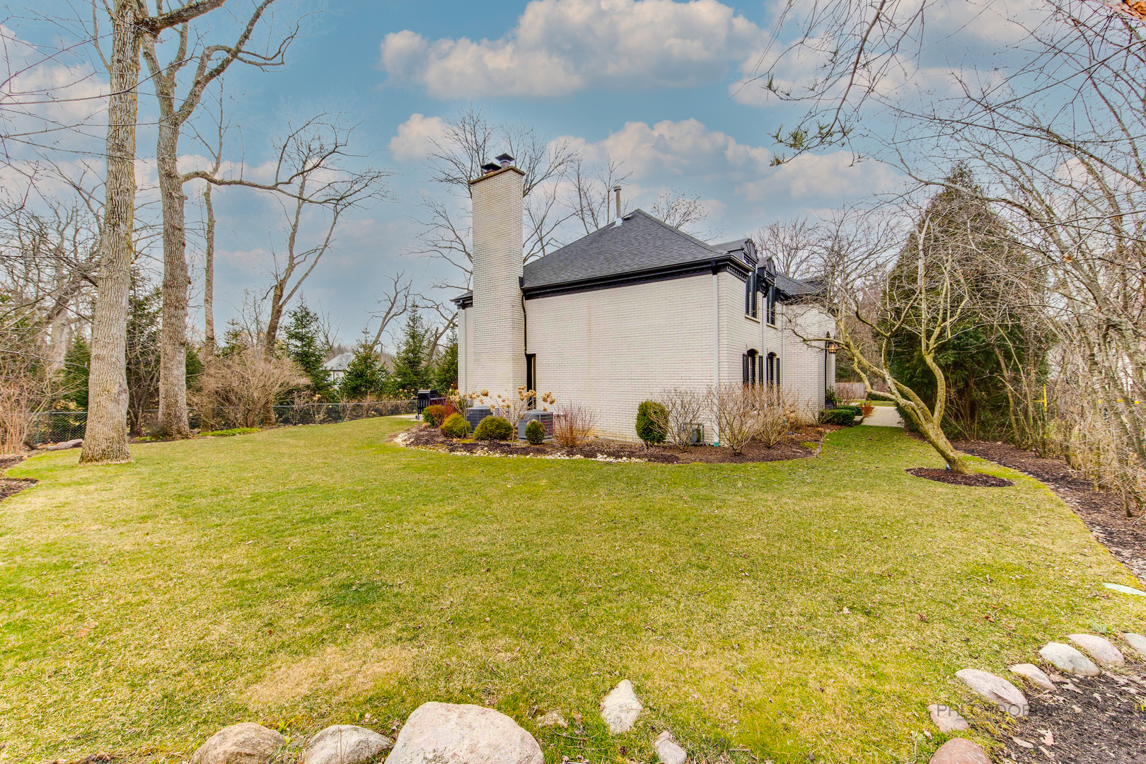 783 Valley Road Glencoe, IL 60022 - Photo 43 of 45 a view of a house with a yard