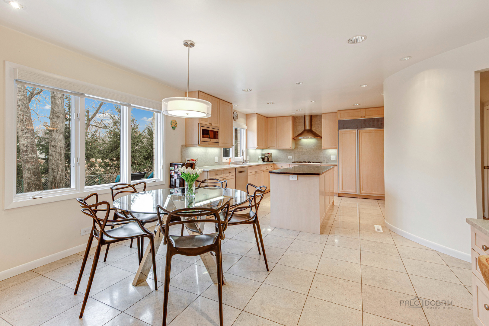 783 Valley Road Glencoe, IL 60022 - Photo 10 of 45 a dining room with furniture a chandelier and a rug