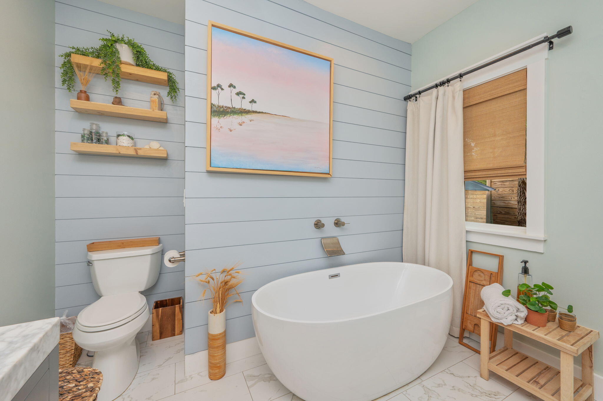 903 Lido Circle East Niceville, FL 32578 - Photo 24 of 64 a white toilet sitting next to a bathroom sink and tub