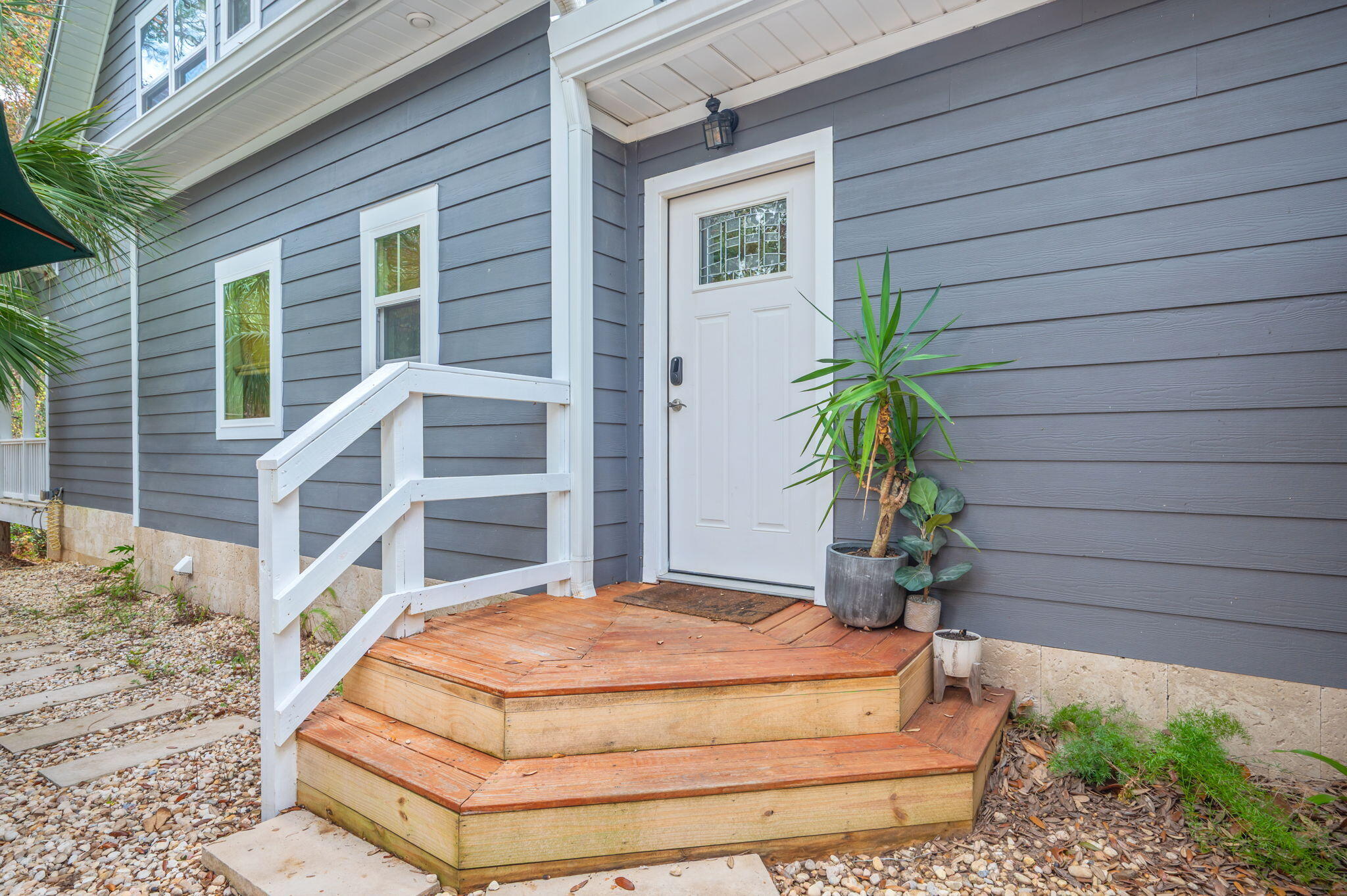 903 Lido Circle East Niceville, FL 32578 - Photo 44 of 64 a blue and white umbrella sitting in front of a house