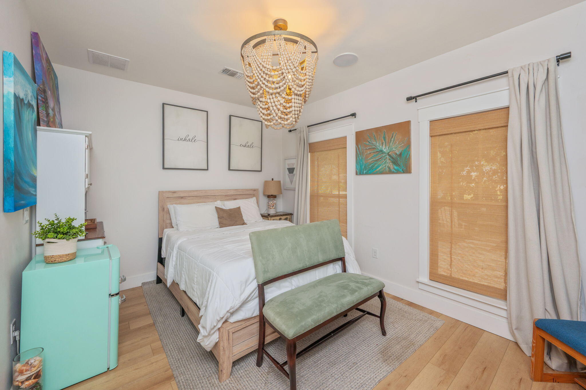 903 Lido Circle East Niceville, FL 32578 - Photo 45 of 64 a bedroom with a bed and a chandelier