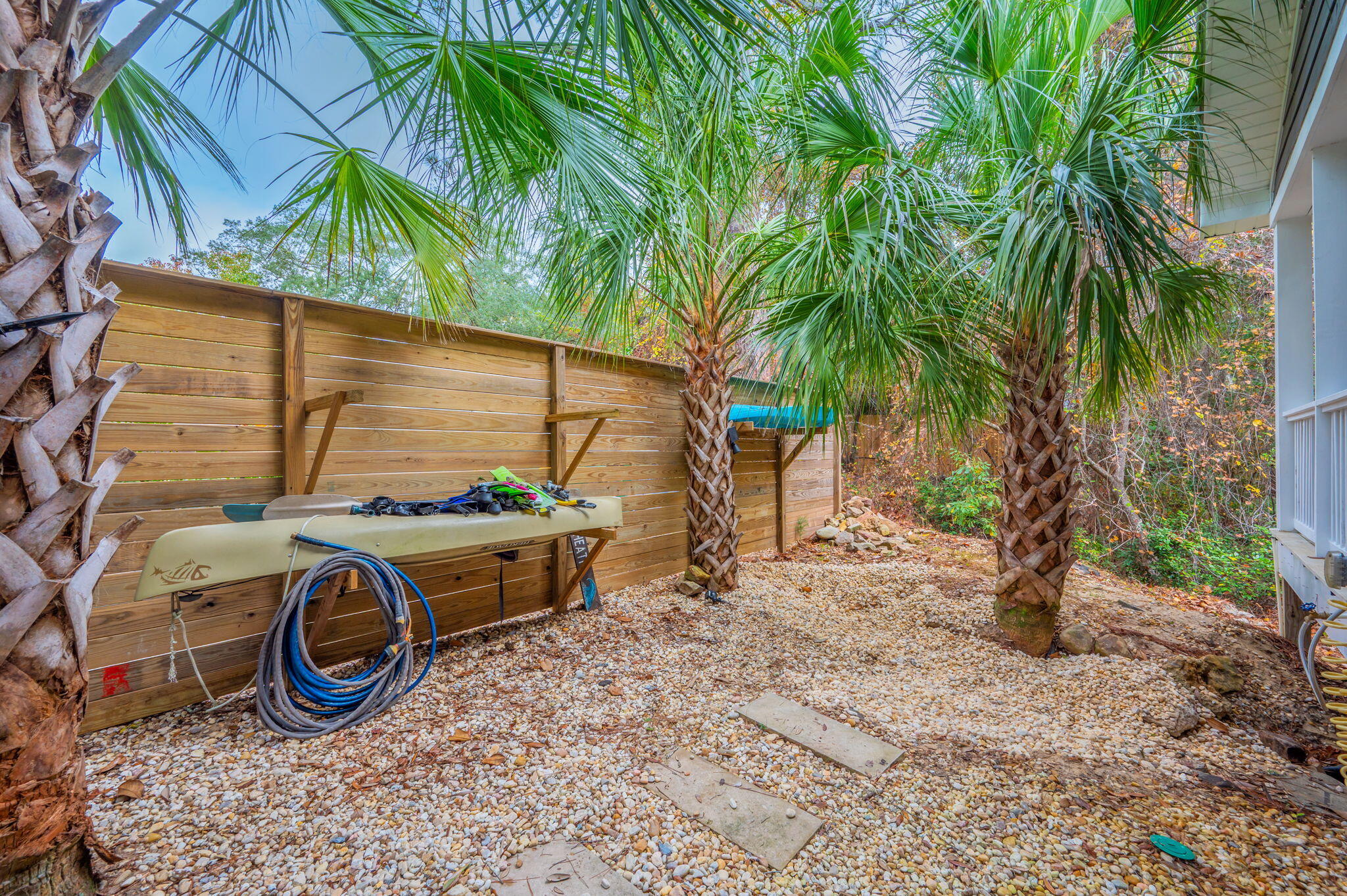 903 Lido Circle East Niceville, FL 32578 - Photo 50 of 64 a backyard of a house with barbeque oven table and chairs