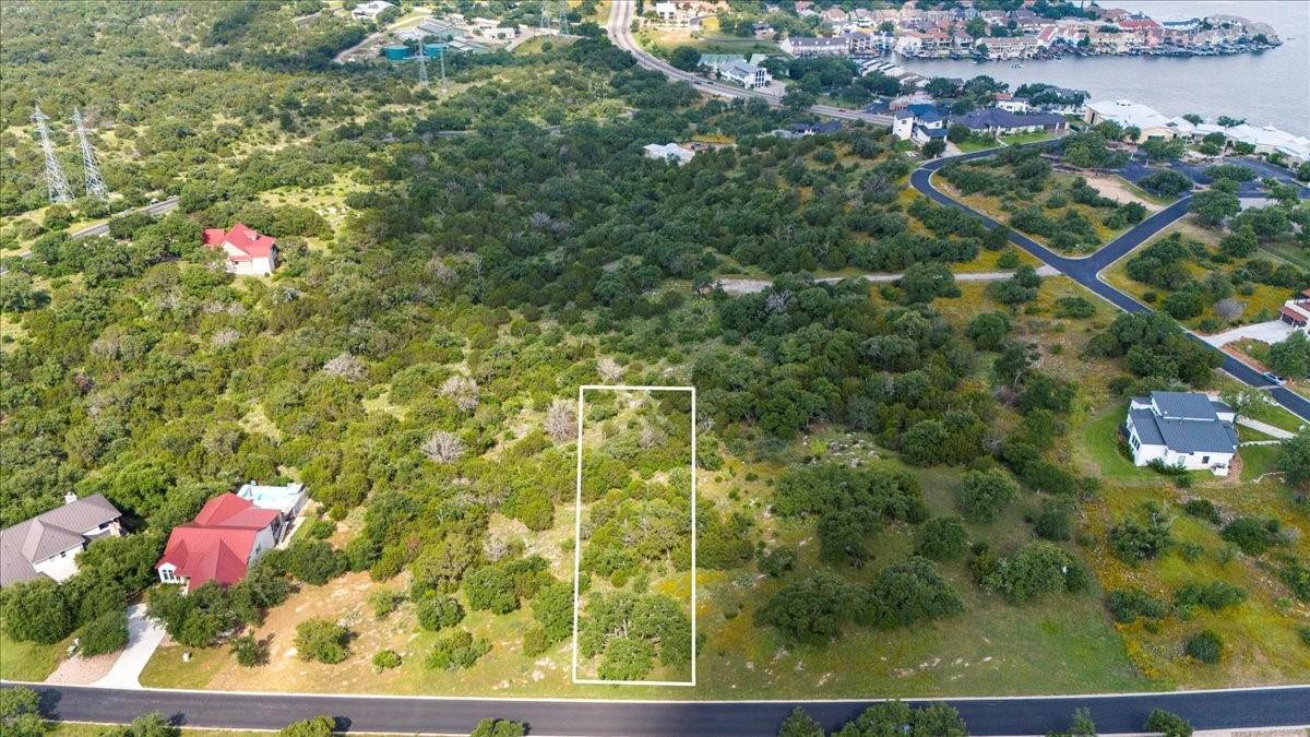 Lot 41118 Hi Ridge Road Horseshoe Bay, TX 78657 - Photo 2 of 10 A spacious, undeveloped lot with abundant trees offers a natural setting for a new build.