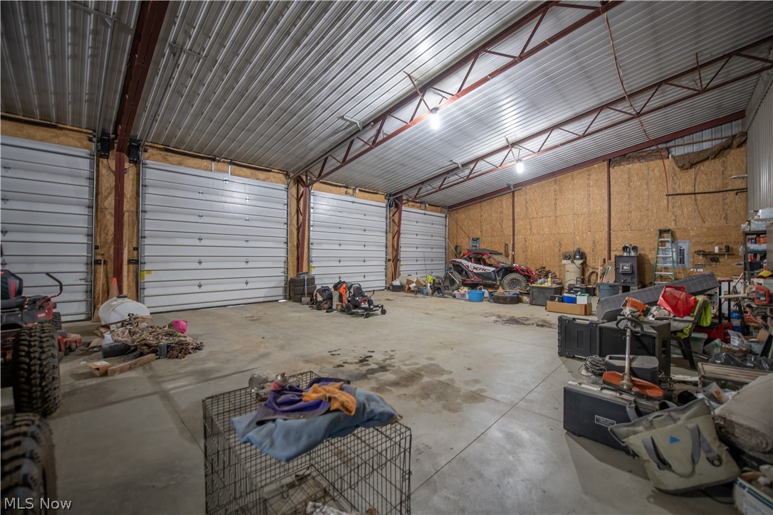 9918 Ridge Road Southeast Uhrichsville, OH 44683 - Photo 37 of 42 36 x 220 Garage With High Doors and Ceilings