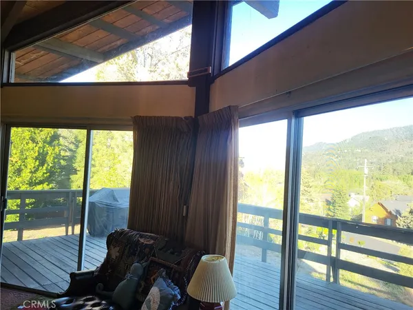 a room with furniture cabinetry and window