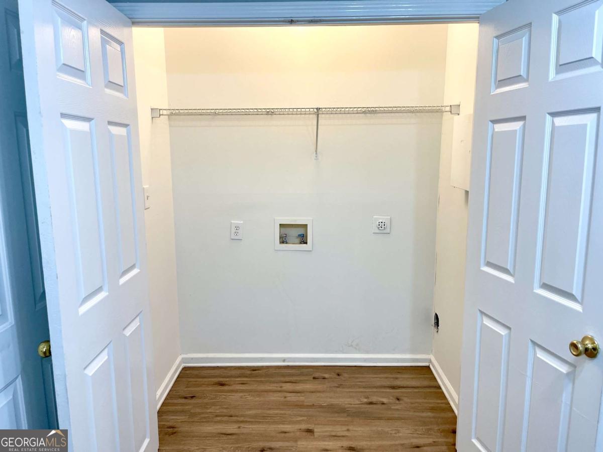 215 Mountain Ridge Covington, GA 30016 - Photo 16 of 23 a view of a small room with wooden floor and cabinet