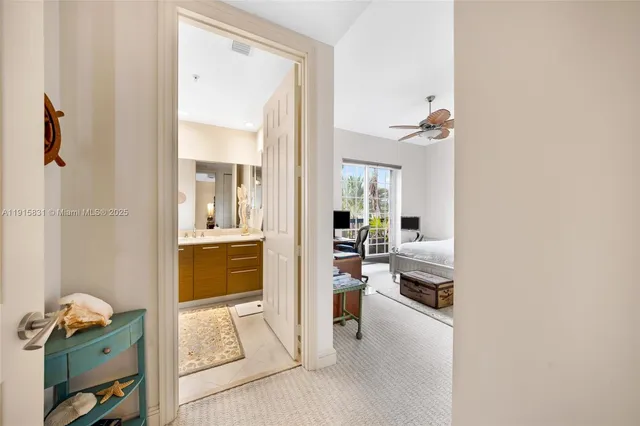 a bedroom with a large bed and a large window