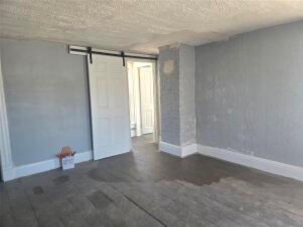 820 West North Street Springfield, OH 45504 - Photo 17 of 20 This versatile room features sliding doors and wood flooring, offering a flexible???????????????????????? space.