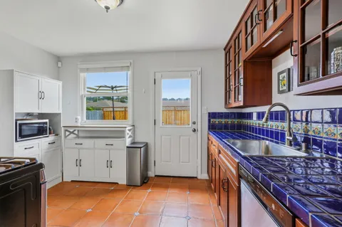 a kitchen that has a lot of cabinets in it