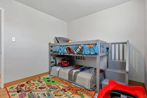 a bedroom with furniture and a bed