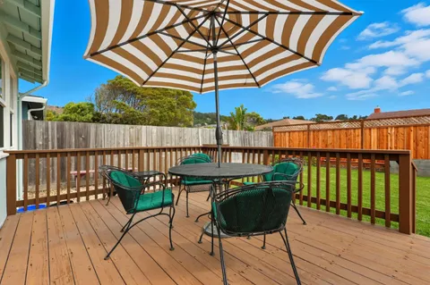 a view of a chairs on the roof deck