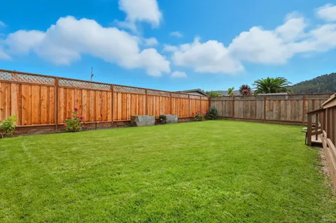a view of a backyard with a cabin