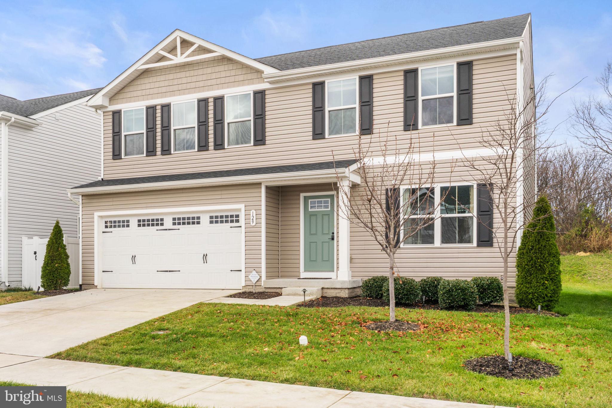 129 Birmingham Drive Middletown, VA 22645 - Photo 11 of 55 front view of a house with a yard