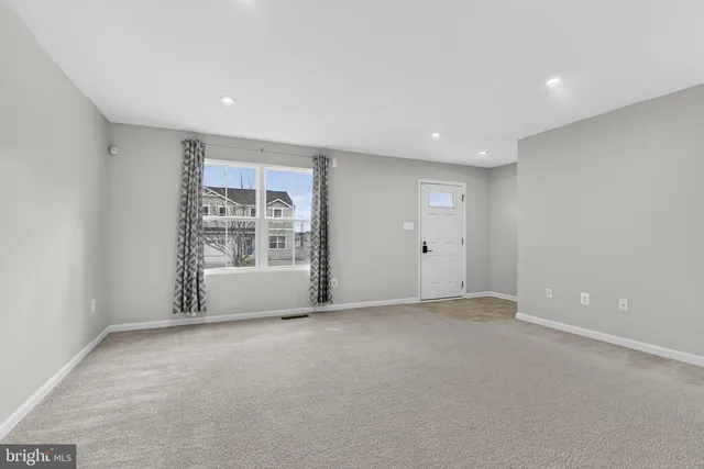 a kitchen with stainless steel appliances granite countertop a refrigerator a sink a stove a microwave and island