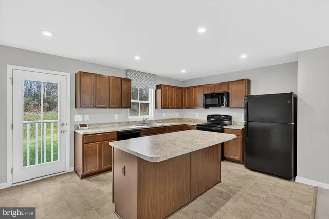 a view of an empty room with stairs