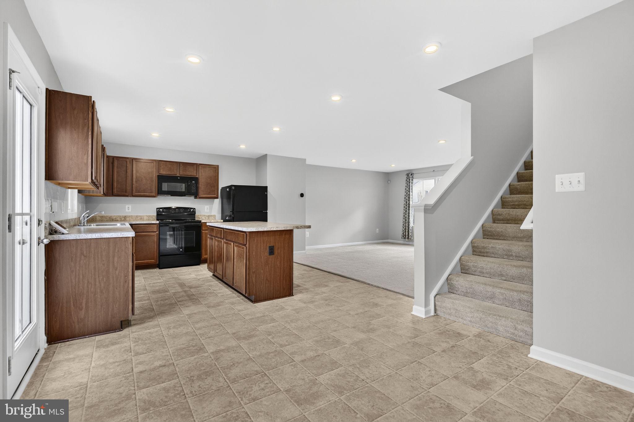 129 Birmingham Drive Middletown, VA 22645 - Photo 25 of 55 a view of kitchen with microwave oven cabinets and furniture