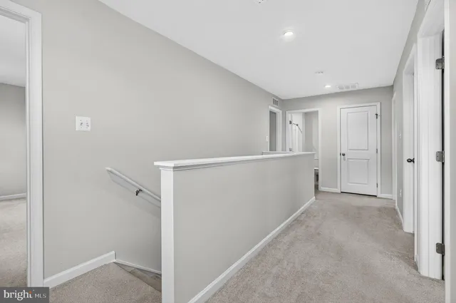 a bathroom with a sink toilet and mirror