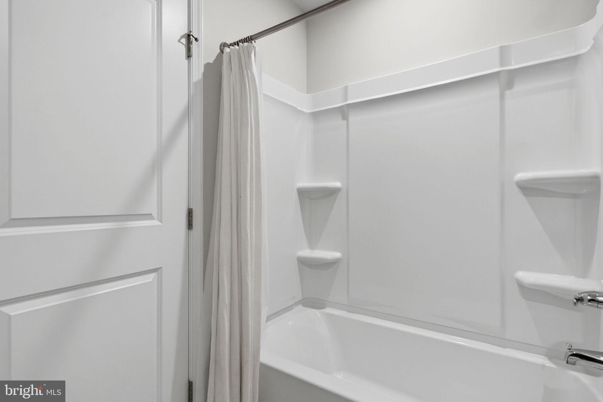 129 Birmingham Drive Middletown, VA 22645 - Photo 36 of 55 a bathroom with a bathtub and a toilet