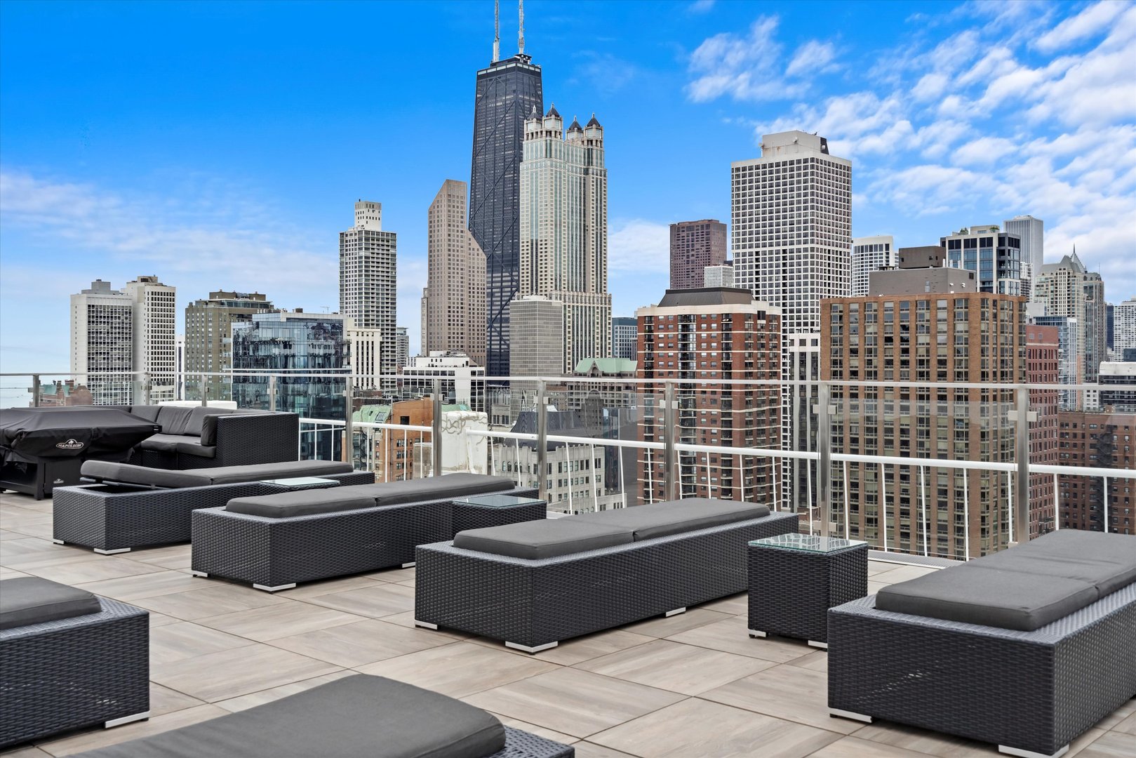 1255 North Sandburg Terrace, Unit 305 Chicago, IL 60610 - Photo 11 of 16 a view of a terrace with couches and potted plants