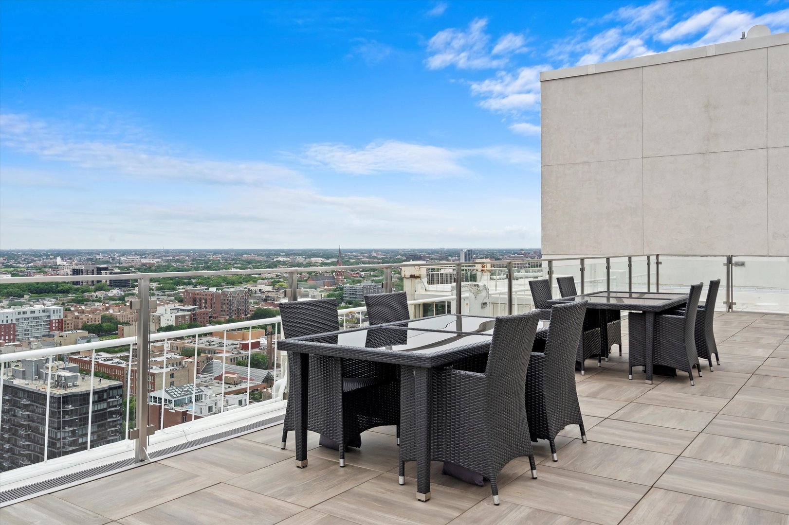 1255 North Sandburg Terrace, Unit 305 Chicago, IL 60610 - Photo 13 of 16 a view of a patio with a table and chairs