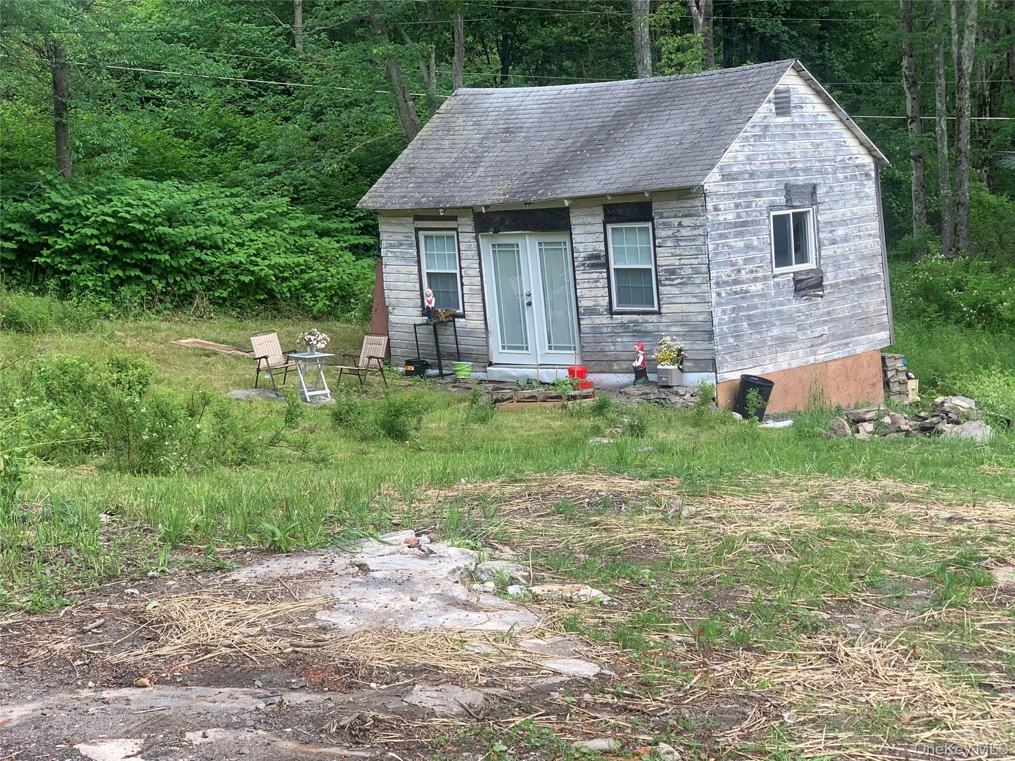 37 Cranberry Road Greenfield Park, NY 12435 - Photo 8 of 9 a front view of a house with a garden and yard