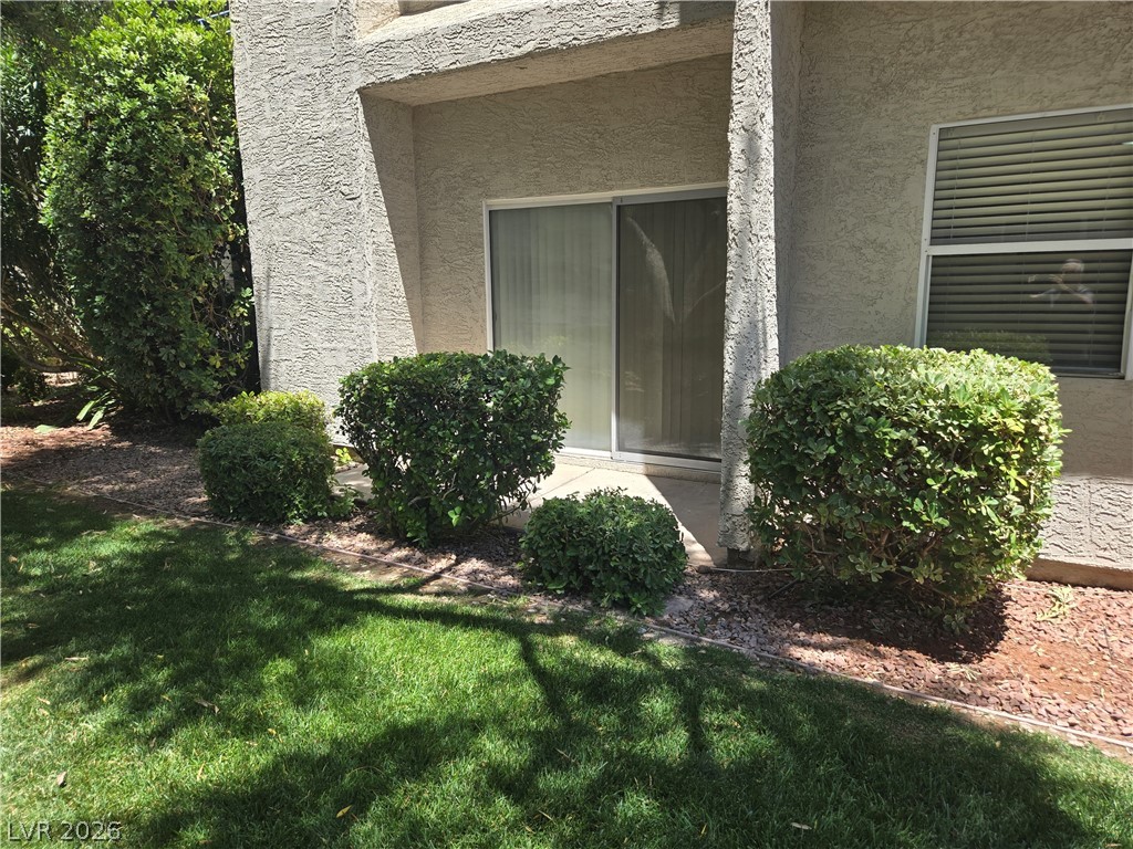 6250 West Flamingo Road, Unit 131 Las Vegas, NV 89103 - Photo 2 of 11 Green landscaping and a private entry invite tranquil outdoor moments.