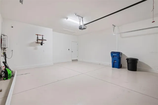 a bathroom with a shower and a glass door
