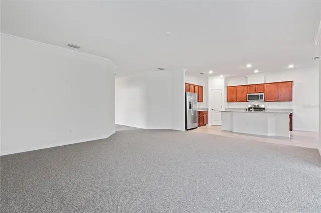 a kitchen with a stove sink and cabinets