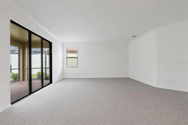a kitchen with granite countertop a stove a sink and a microwave