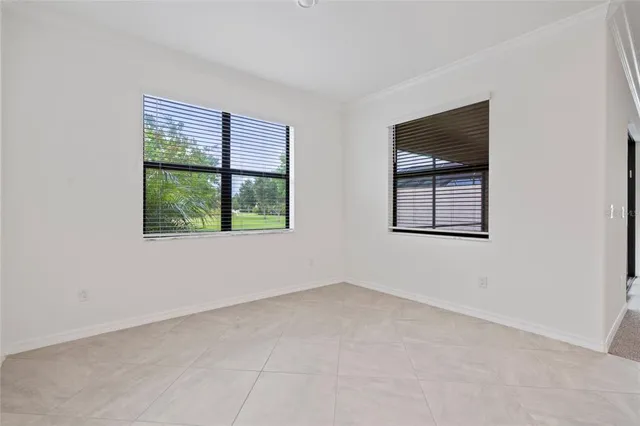 a aerial view of a house with a yard and a garden